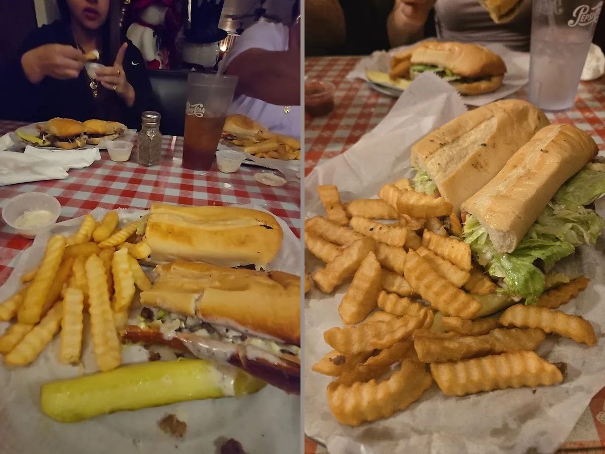A salad and fries served beside pizza.