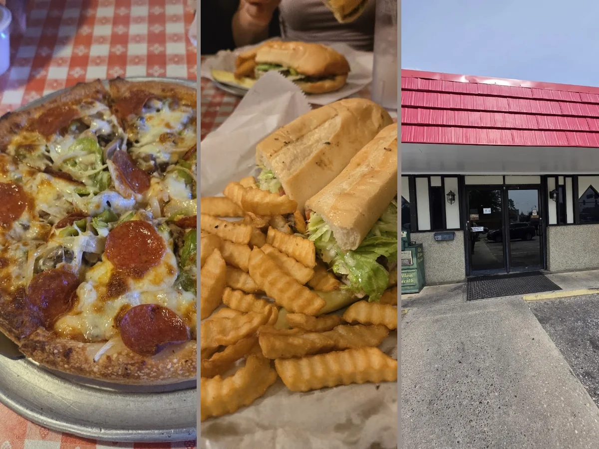 A salad and fries served beside pizza.